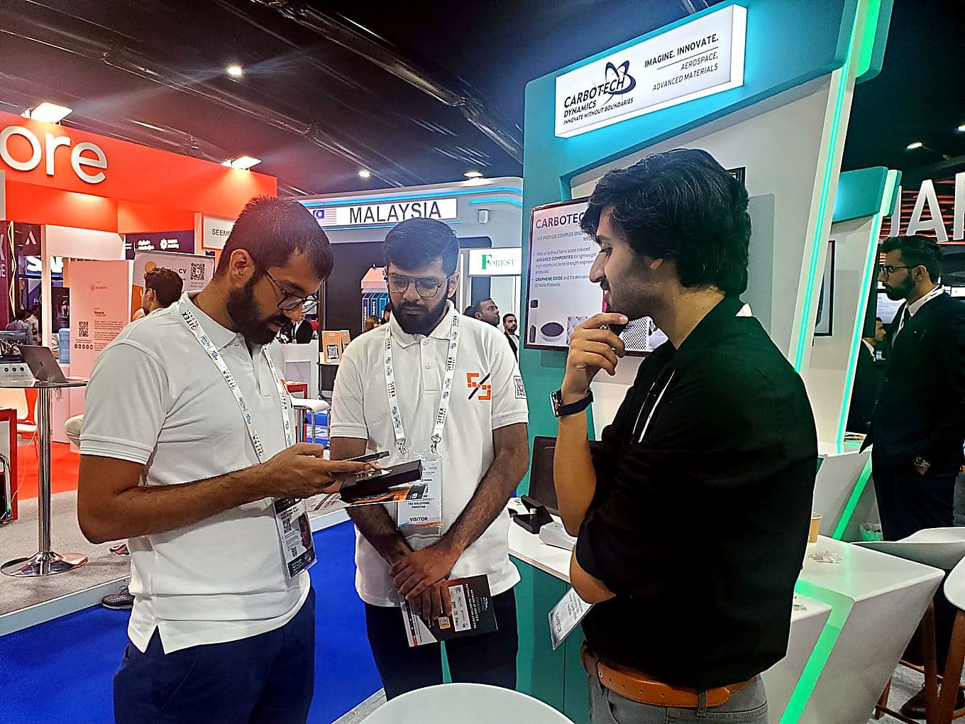 Reviewing a product demo with an exhibitor team on the show floor